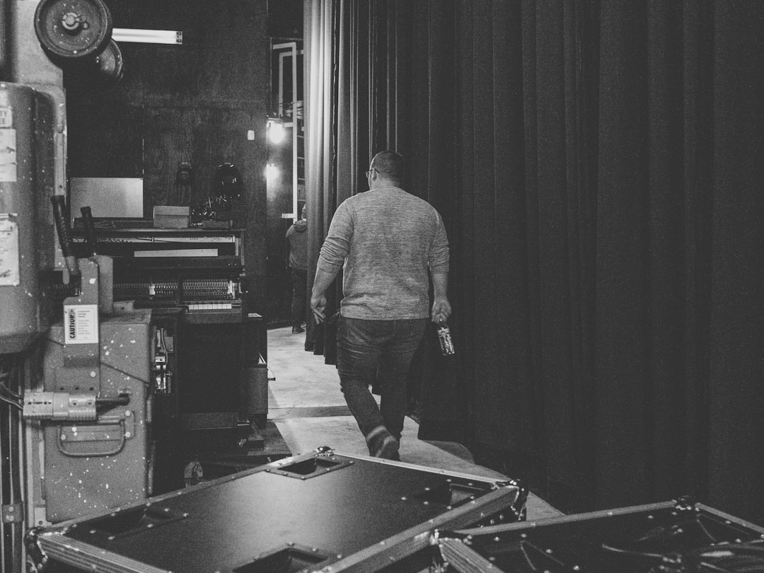 Event team member walking through a backstage production area